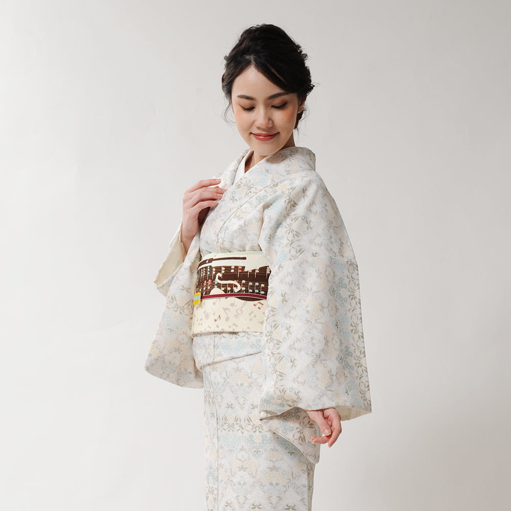 京袋帯 歓喜の歌(ベージュ)|ホルン|ピアノ|前柄アレンジ|サイズ:長さ約375cm幅約31cm|素材:表地 絹100%裏地 絹綿混|生産:日本